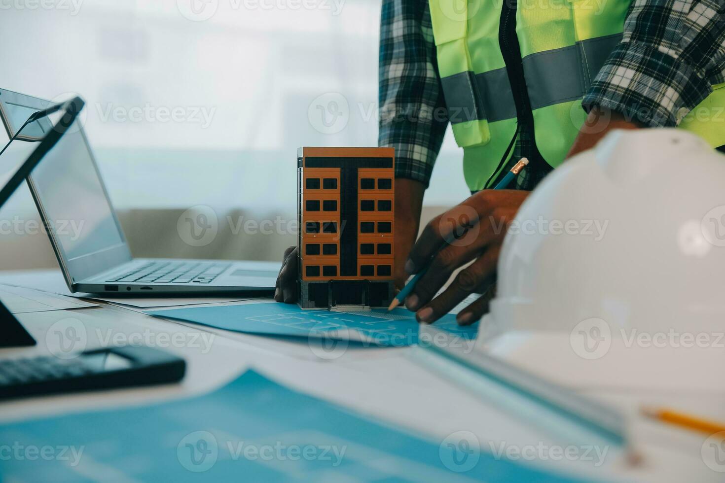 Construction and structure concept of Engineer or architect meeting for project working with partner and engineering tools on model building and blueprint in working site, contract for both companies. photo