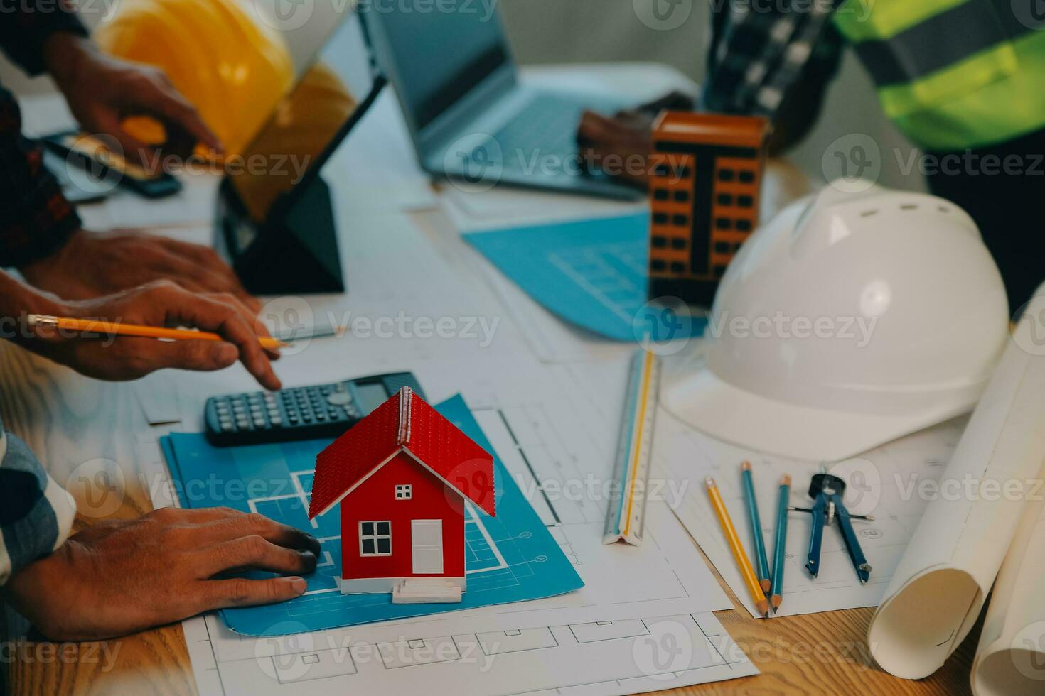 Construction and structure concept of Engineer or architect meeting for project working with partner and engineering tools on model building and blueprint in working site, contract for both companies. photo