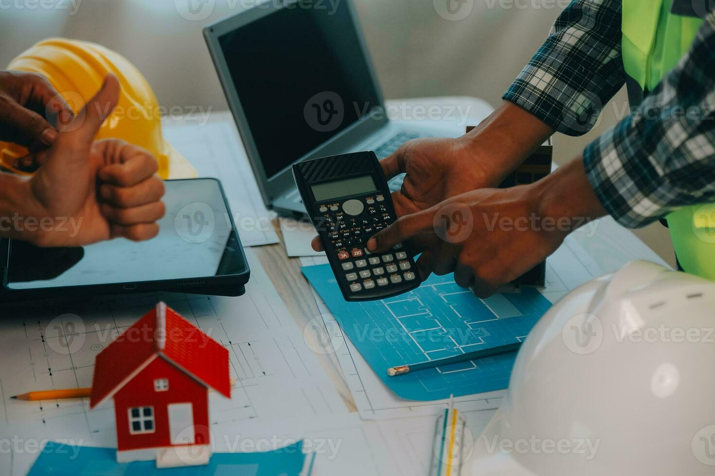 Construction and structure concept of Engineer or architect meeting for project working with partner and engineering tools on model building and blueprint in working site, contract for both companies. photo
