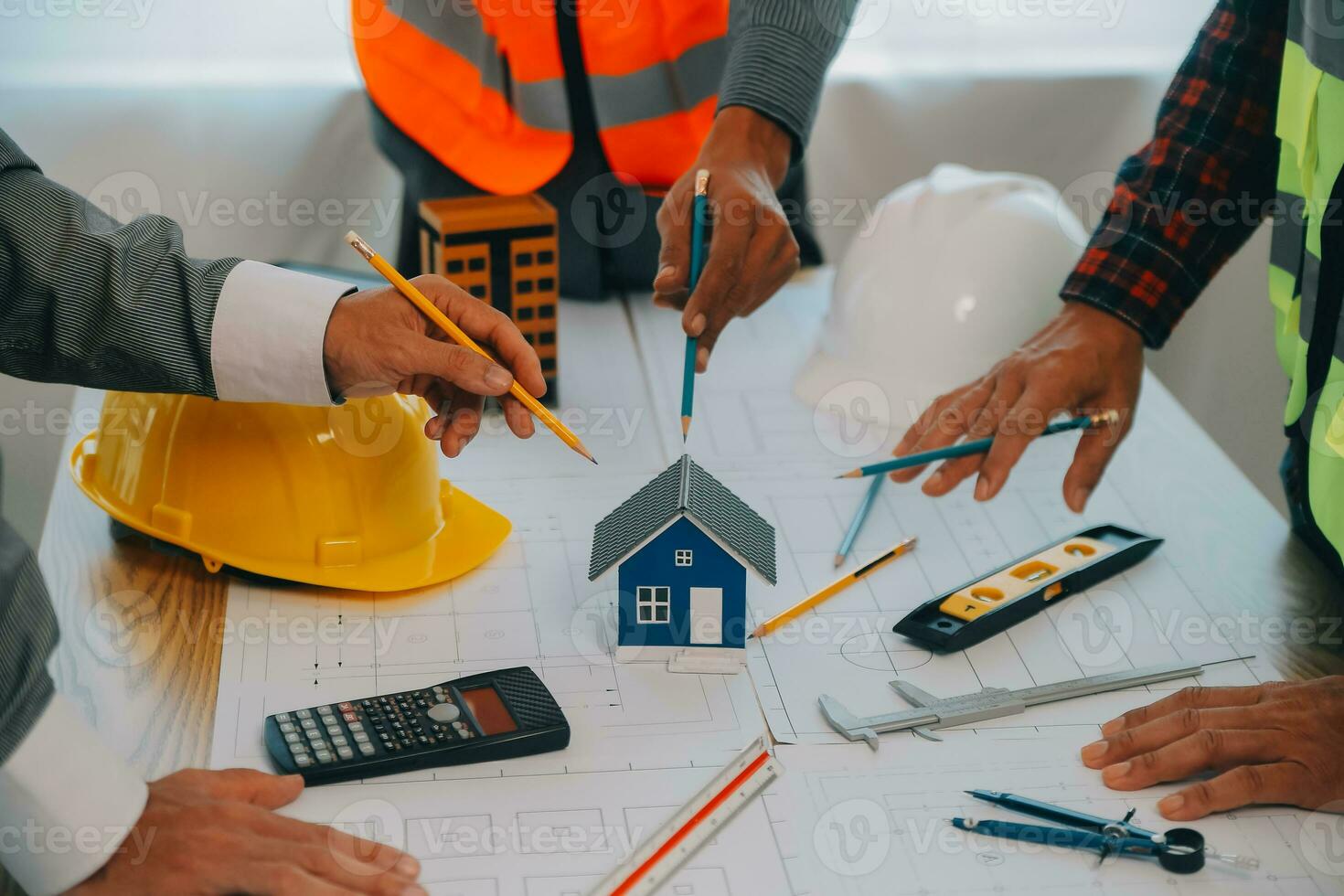 Construction and structure concept of Engineer or architect meeting for project working with partner and engineering tools on model building and blueprint in working site, contract for both companies. photo