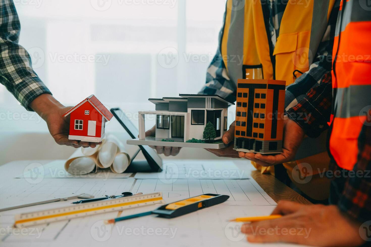 Construction and structure concept of Engineer or architect meeting for project working with partner and engineering tools on model building and blueprint in working site, contract for both companies. photo