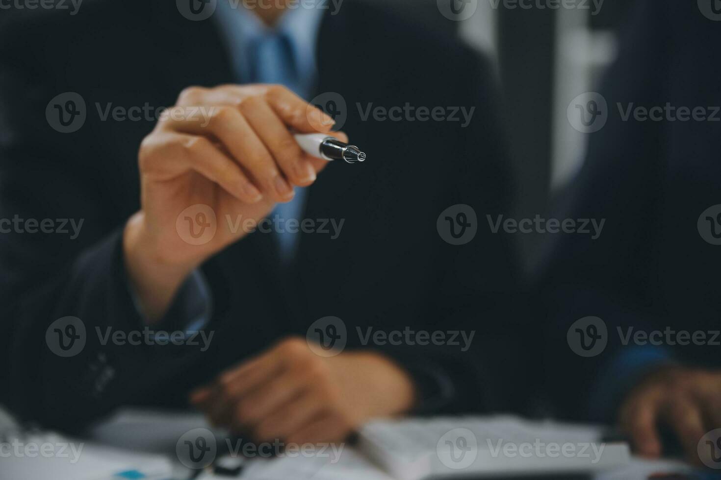 Financial analysts analyze business financial reports on a digital tablet planning investment project during a discussion at a meeting of corporate showing the results of their successful teamwork. photo