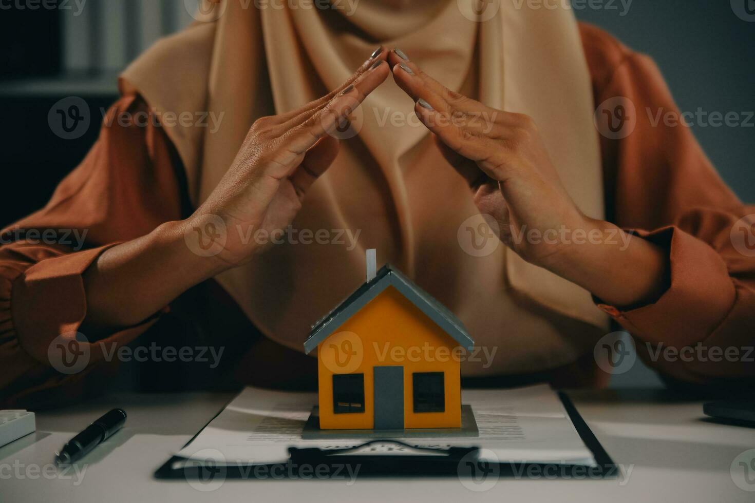 Real estate agent and customer signing contract to buy house, insurance or loan real estate.rent a house,get insurance or loan real estate or property. photo
