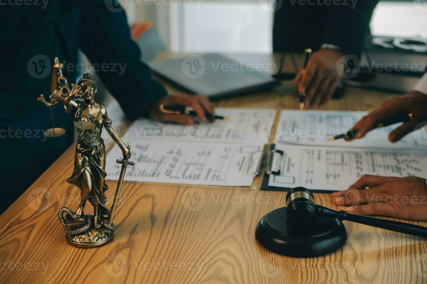 Consultation and conference of Male lawyers and professional businesswoman working and discussion having at law firm in office. Concepts of law, Judge gavel with scales of justice. photo