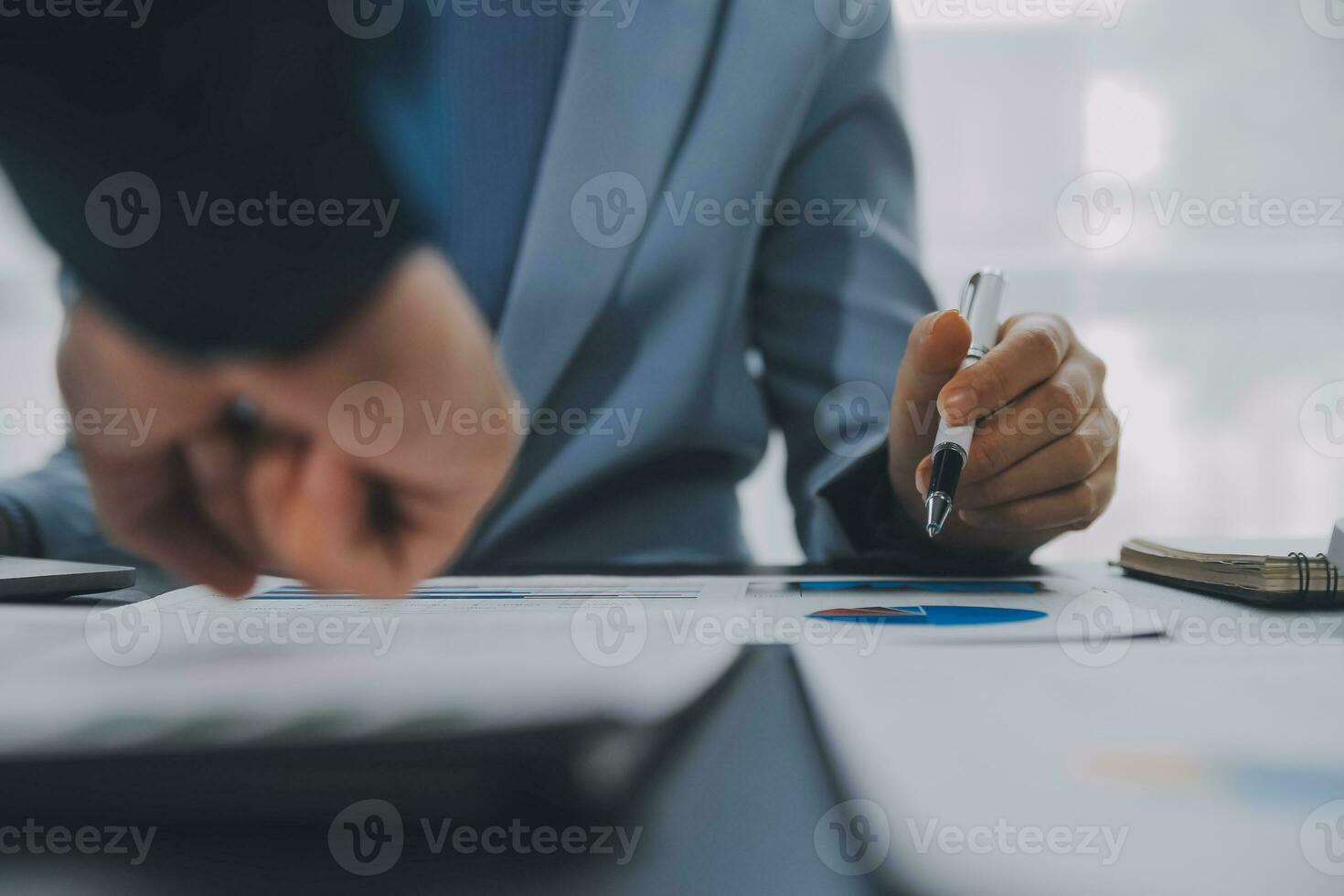 Financial Business team present. Business man hands hold documents with financial statistic stock photo, discussion, and analysis report data the charts and graphs. Finance Financial concept photo