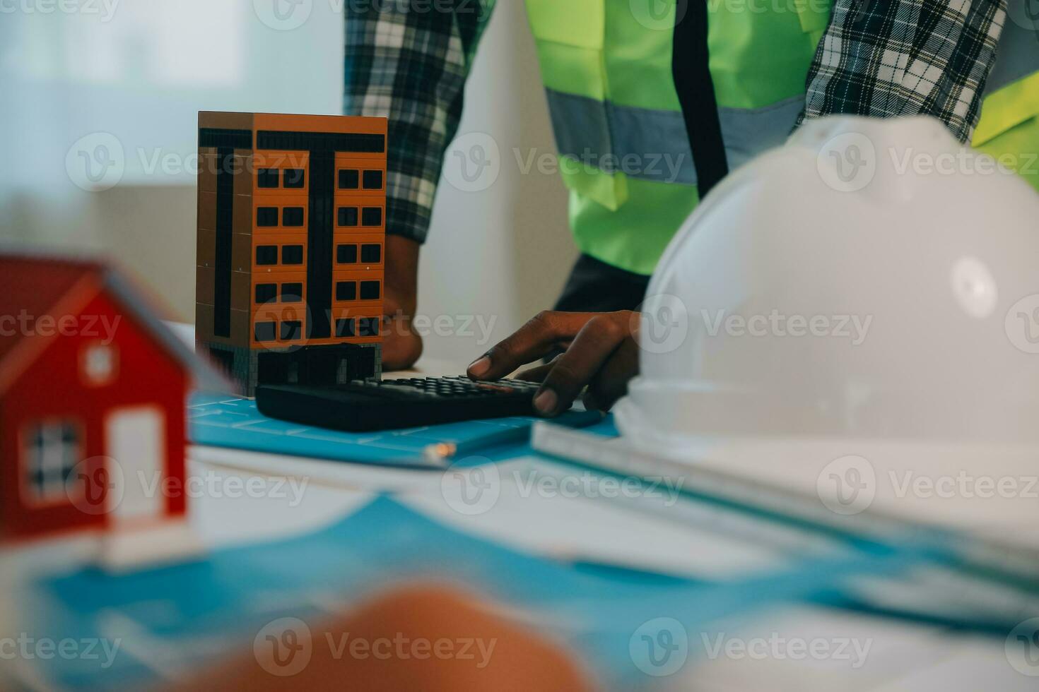 Construction and structure concept of Engineer or architect meeting for project working with partner and engineering tools on model building and blueprint in working site, contract for both companies. photo