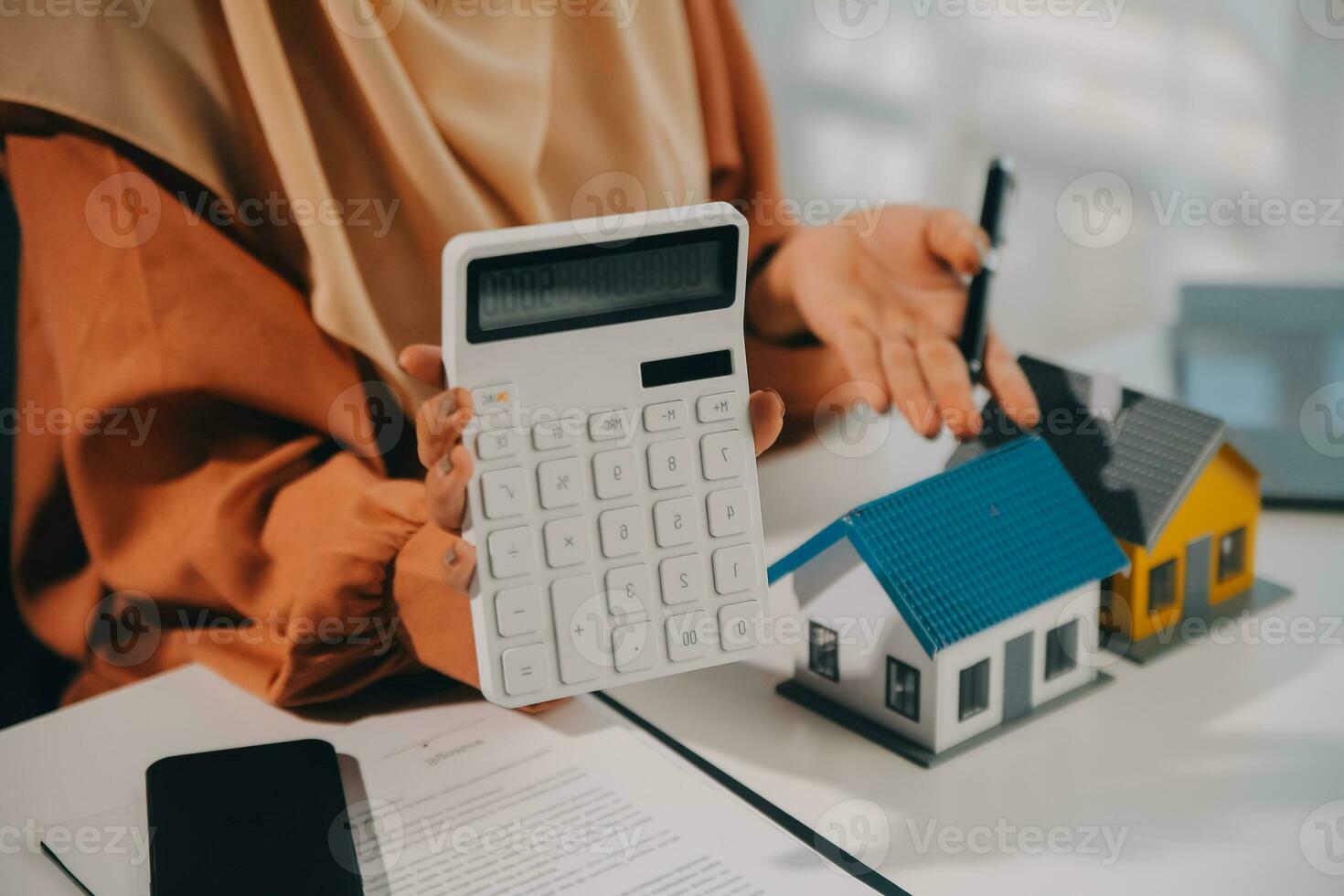 Real estate agent and customer signing contract to buy house, insurance or loan real estate.rent a house,get insurance or loan real estate or property. photo