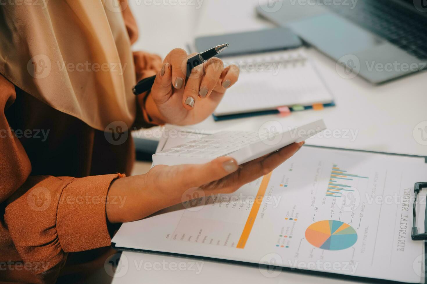 Businesswoman or accountant working Financial investment on calculator, calculate, analyze business and marketing growth on financial document data graph, Accounting, Economic, commercial concept. photo