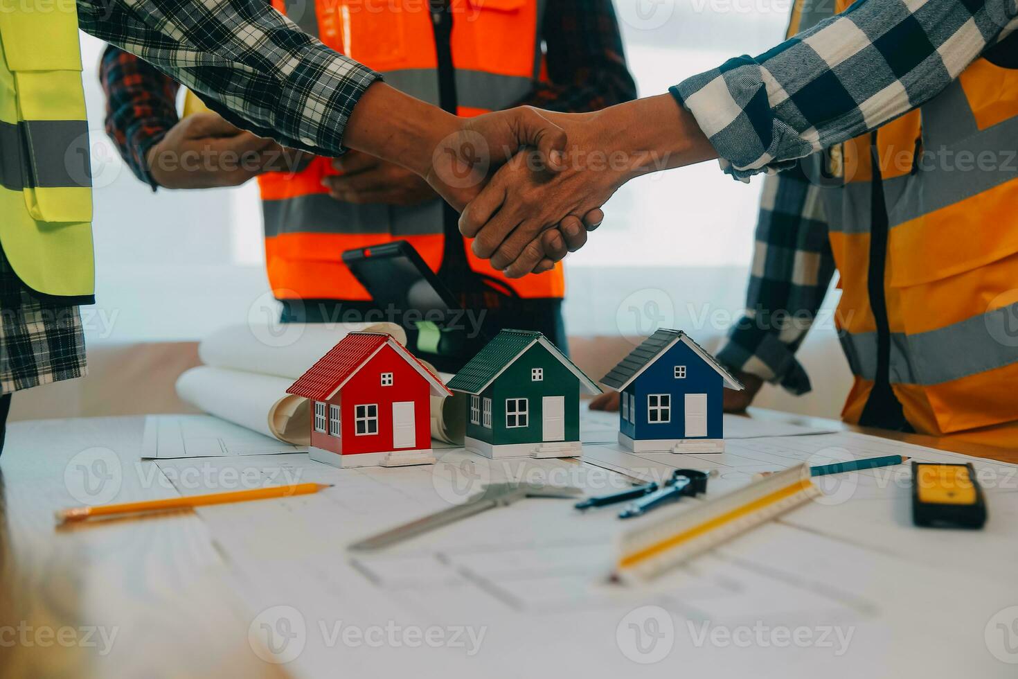 Construction and structure concept of Engineer or architect meeting for project working with partner and engineering tools on model building and blueprint in working site, contract for both companies. photo
