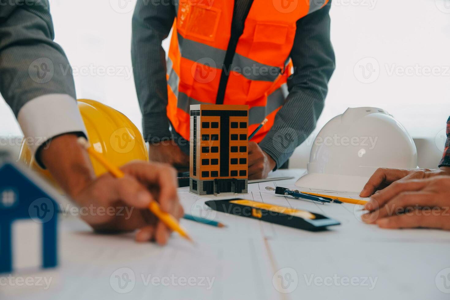 Construction and structure concept of Engineer or architect meeting for project working with partner and engineering tools on model building and blueprint in working site, contract for both companies. photo
