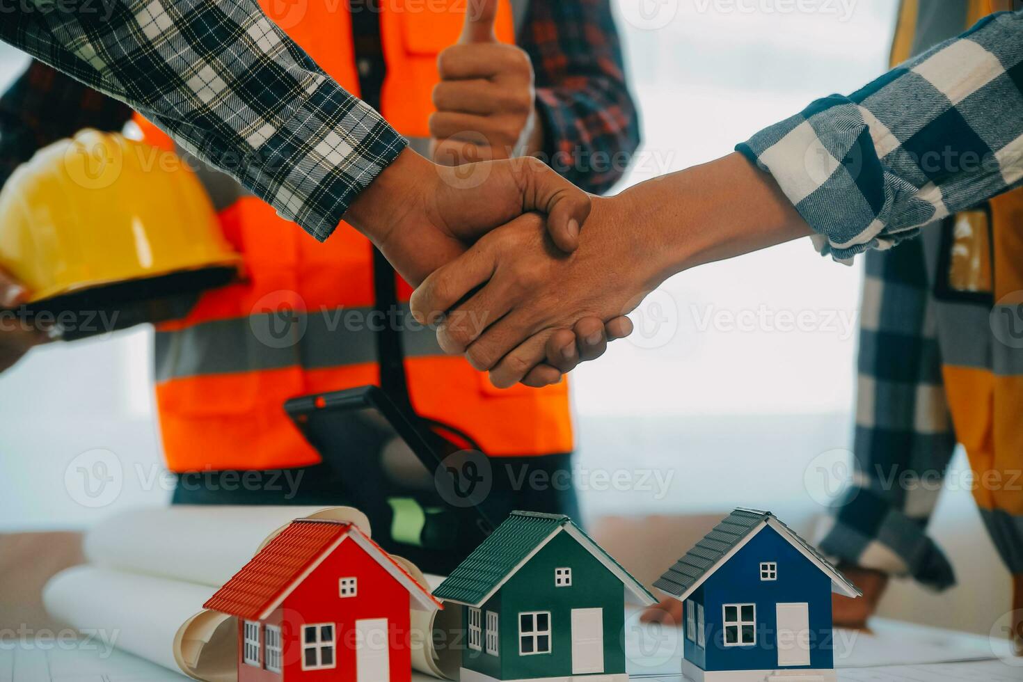 Construction and structure concept of Engineer or architect meeting for project working with partner and engineering tools on model building and blueprint in working site, contract for both companies. photo