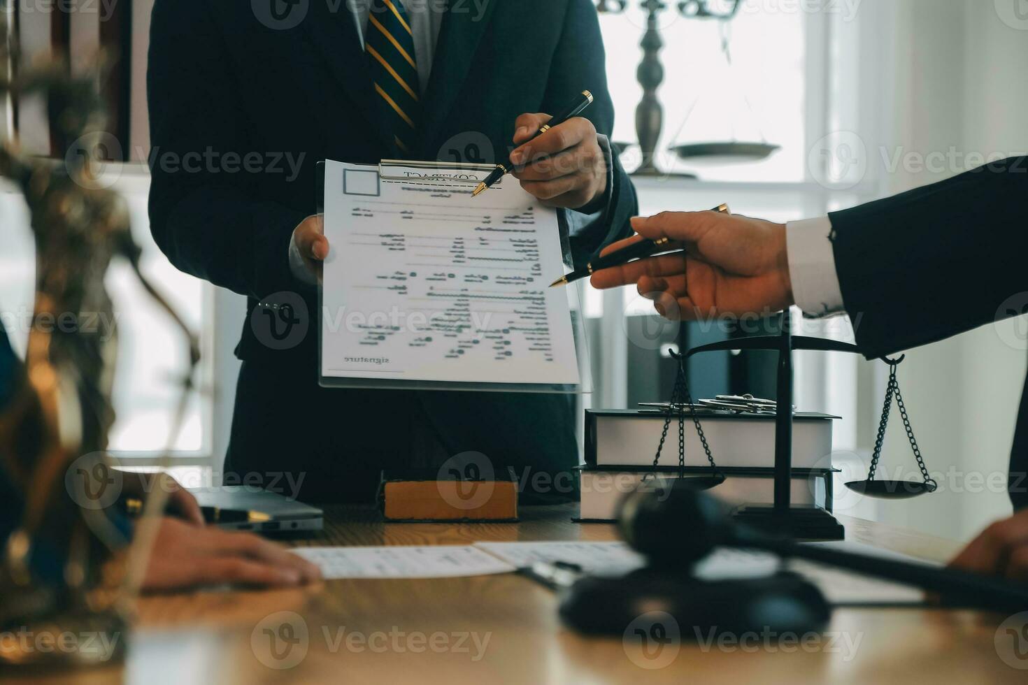 Consultation and conference of Male lawyers and professional businesswoman working and discussion having at law firm in office. Concepts of law, Judge gavel with scales of justice. photo