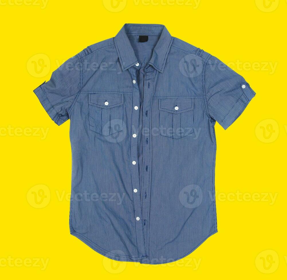 Button shirt on yellow background photo