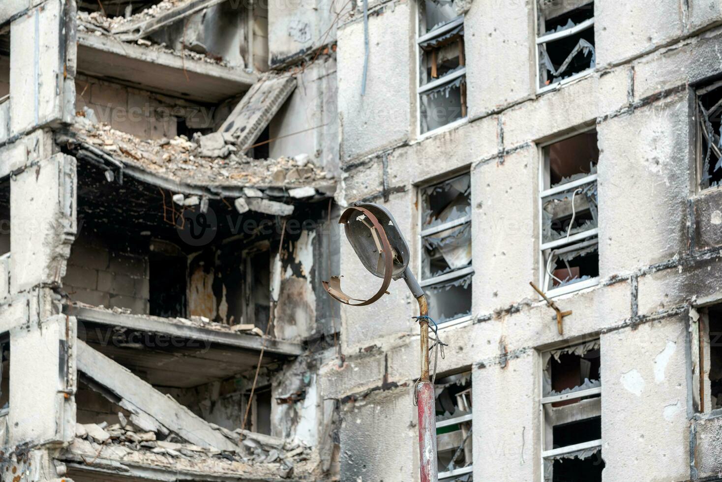 destroyed and burned houses in the city during the war in Ukraine photo