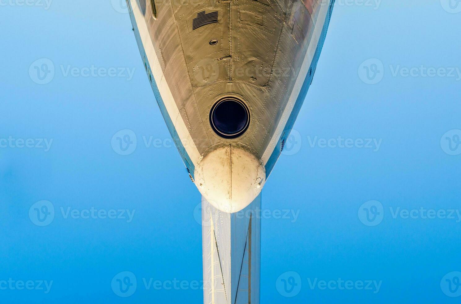 fragment of the plane of an old airliner against a blue sky photo