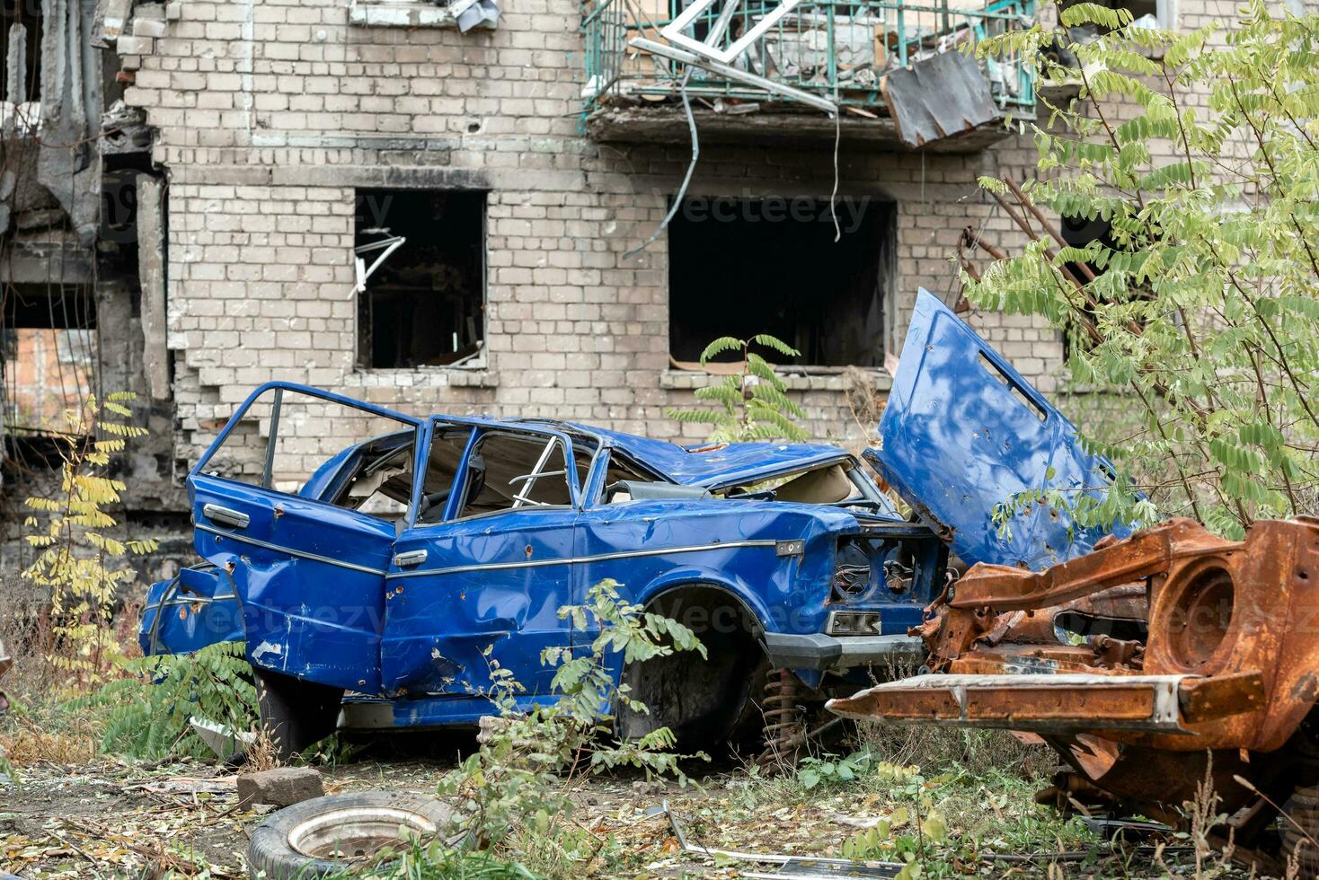 damaged and looted cars in a city in Ukraine during the war photo