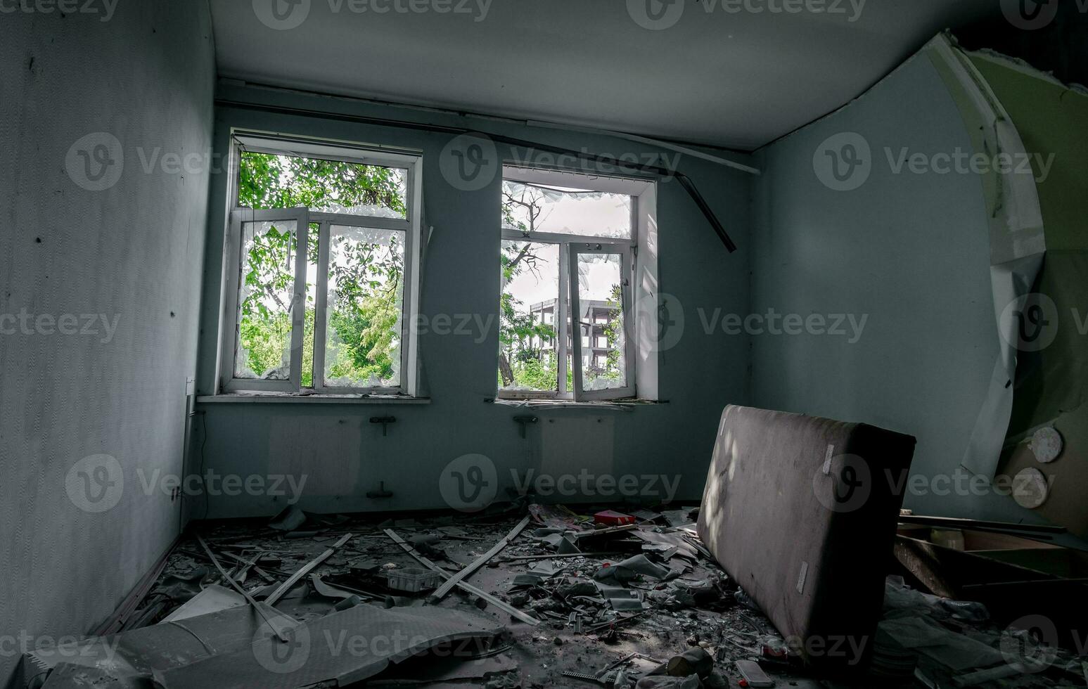 inside a destroyed house without people in an abandoned city in Ukraine photo