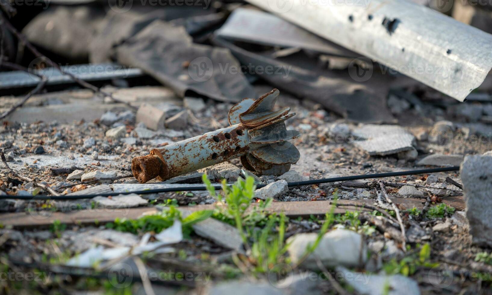 tail of an exploding mine on a city street in Ukraine photo
