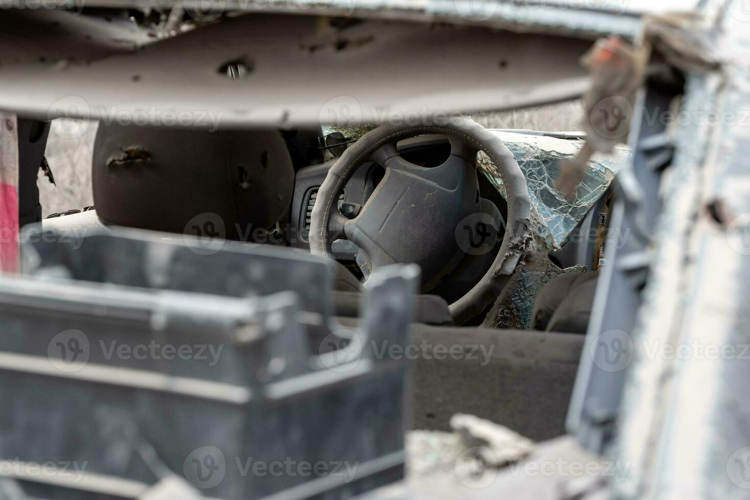 damaged and looted cars in a city in Ukraine during the war photo
