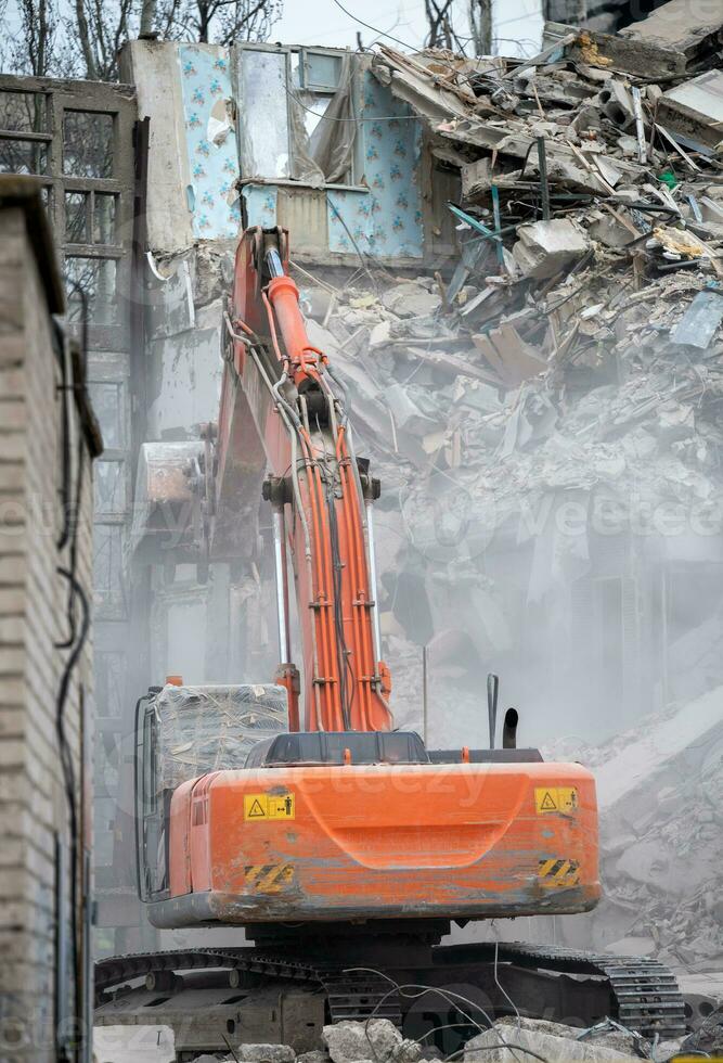 construction equipment destroys affected houses war in Ukraine photo
