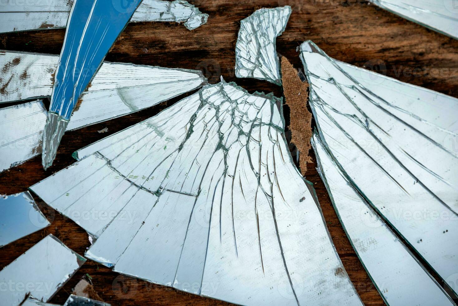 shards of a broken mirror close up photo