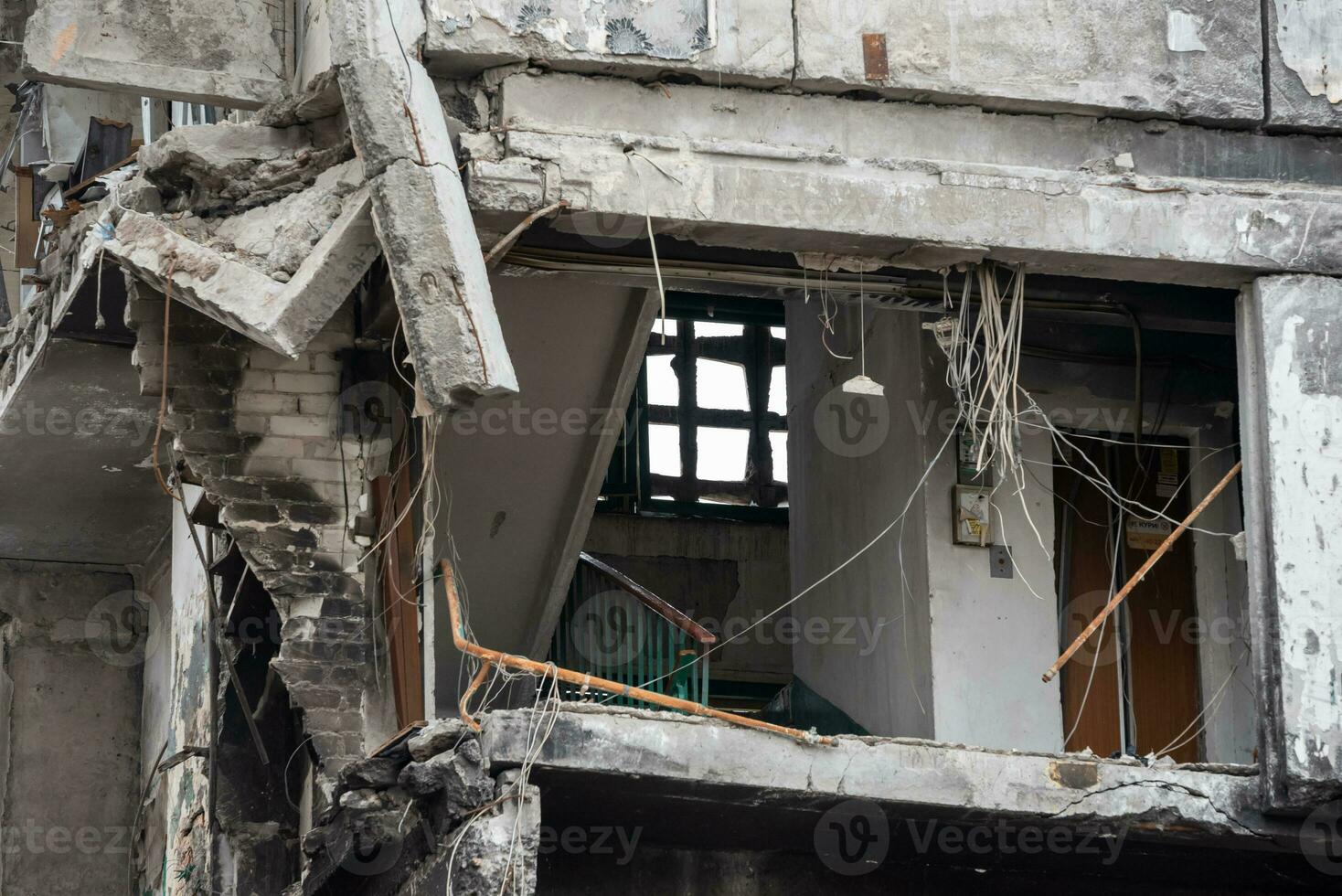 destroyed and burned houses in the city during the war in Ukraine photo