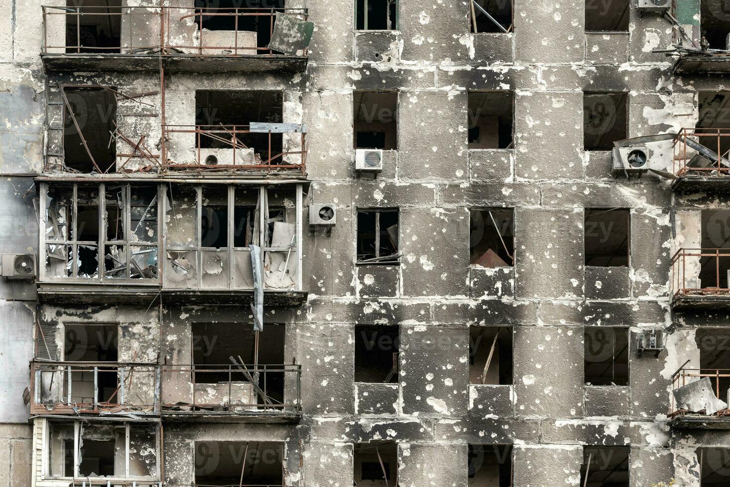 destroyed and burned houses in the city during the war in Ukraine photo