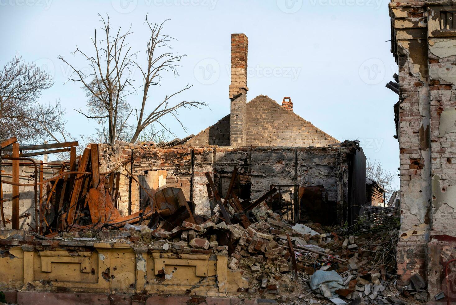 destroyed and burned houses in the city Russia Ukraine war photo