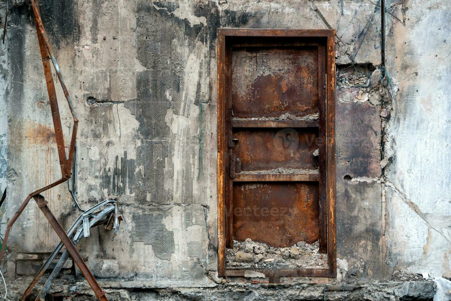 door and wall of a destroyed and burnt house in Ukraine photo