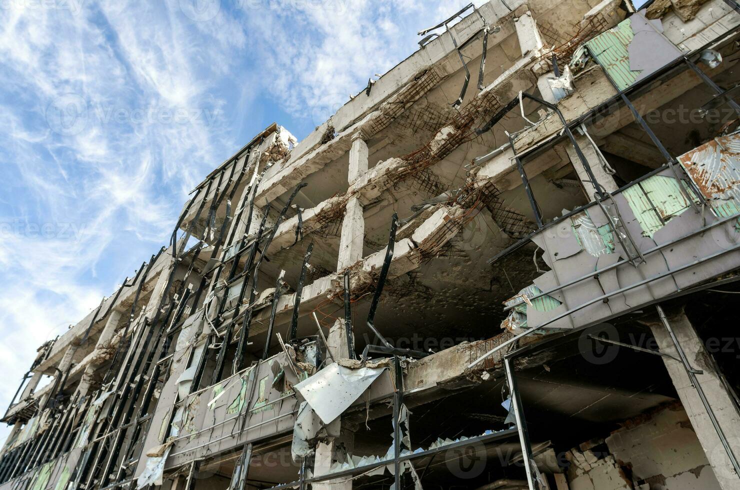 destroyed and burned houses in the city during the war in Ukraine photo