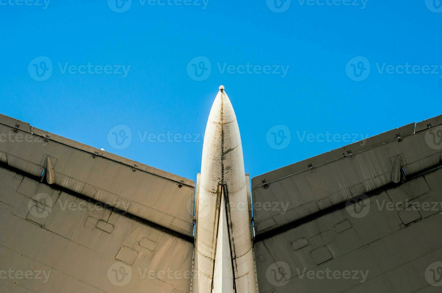 fragment of airplane wings on a background of blue sky photo