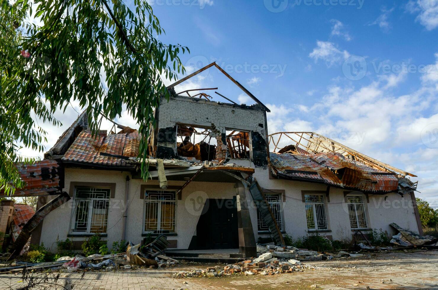 destroyed and burned houses in the city during the war in Ukraine photo