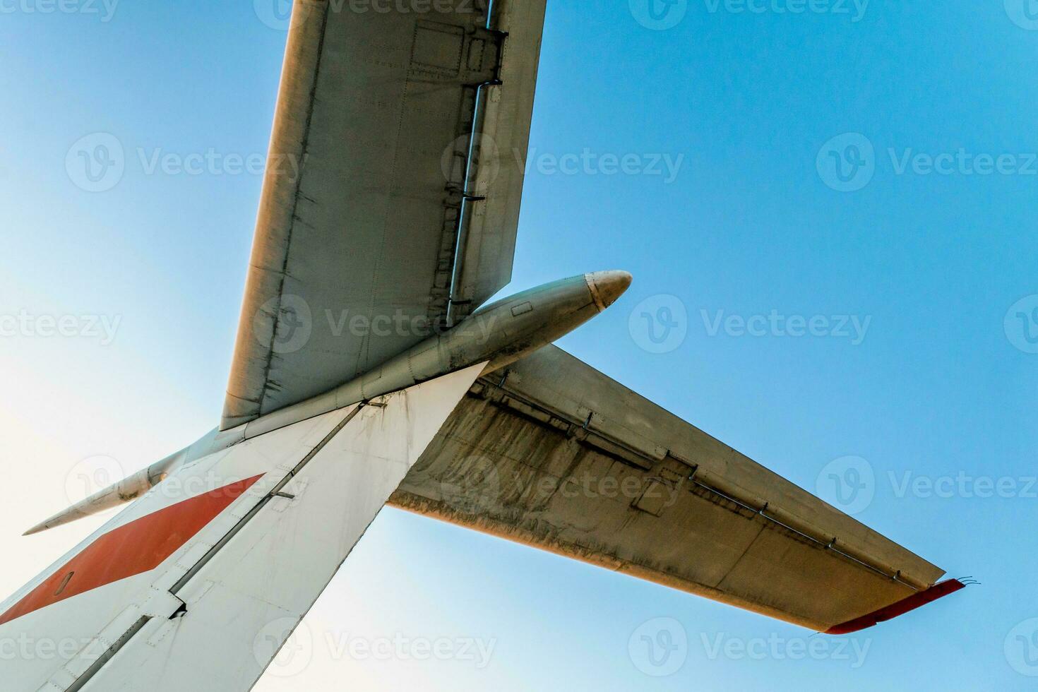 wings of a large soviet airliner against a blue sky photo