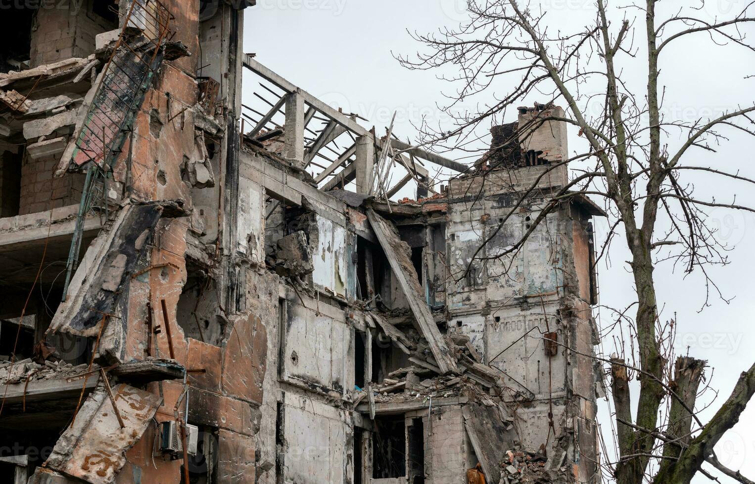 destroyed and burned houses in the city during the war in Ukraine photo