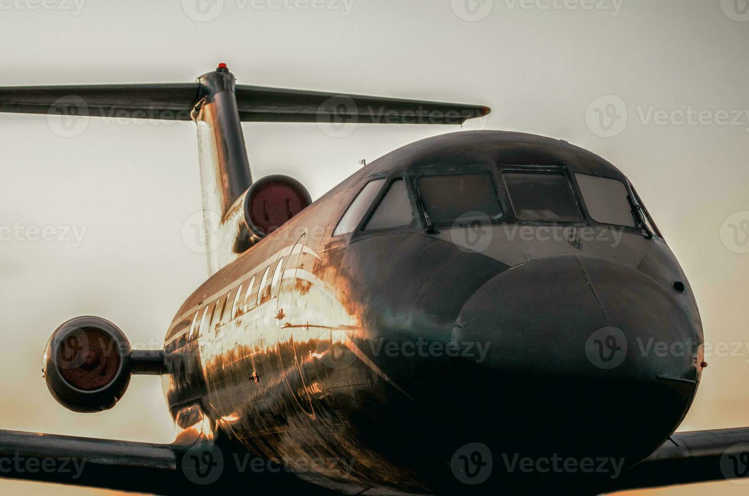 large airliner against the sunset evening sky photo