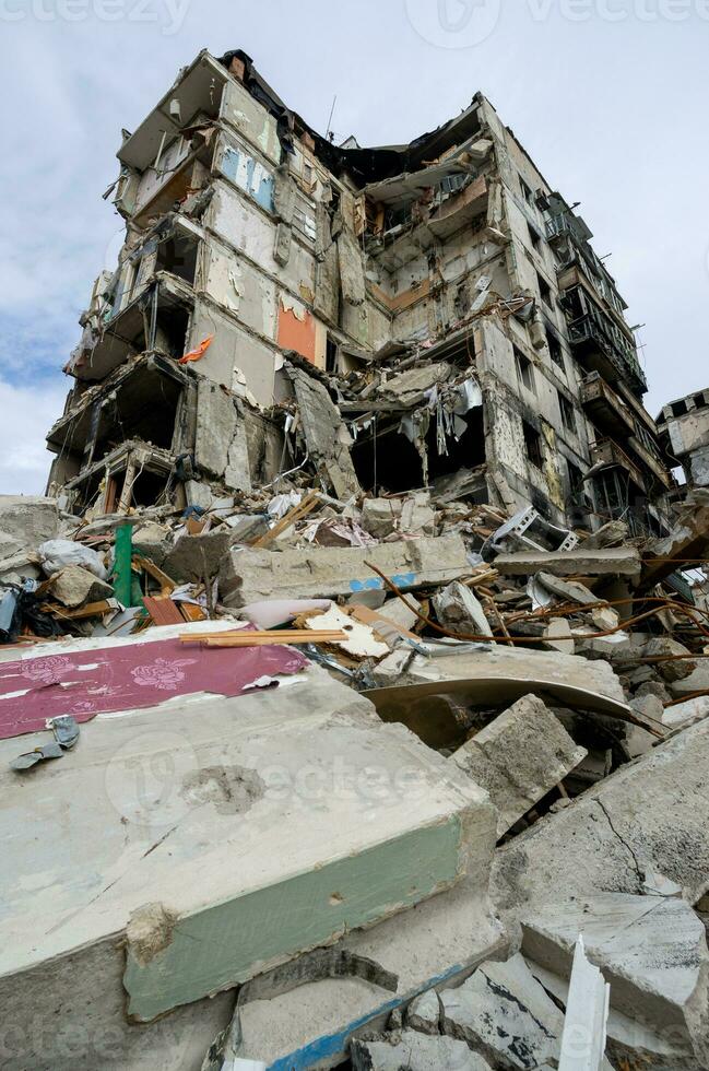 destroyed and burned houses in the city during the war in Ukraine photo