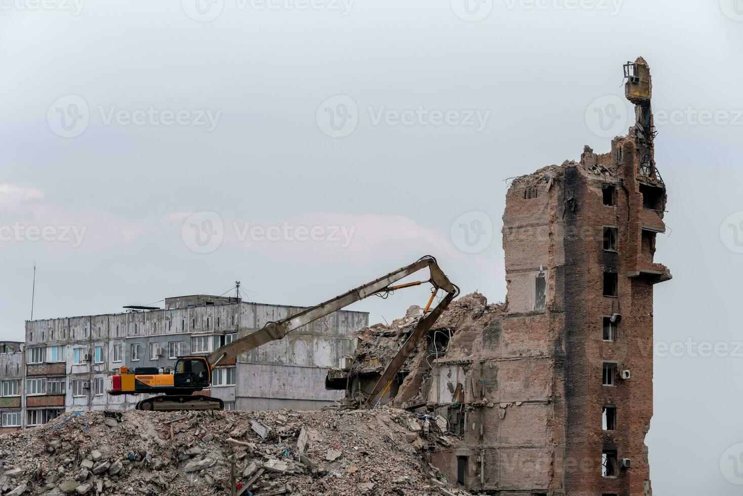 construction equipment destroys affected houses war in Ukraine photo
