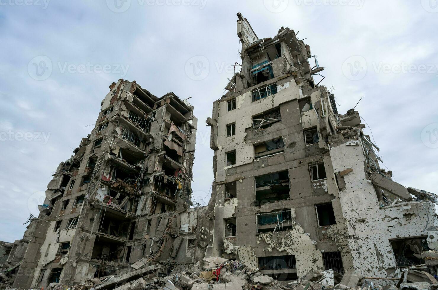 destroyed and burned houses in the city during the war in Ukraine photo
