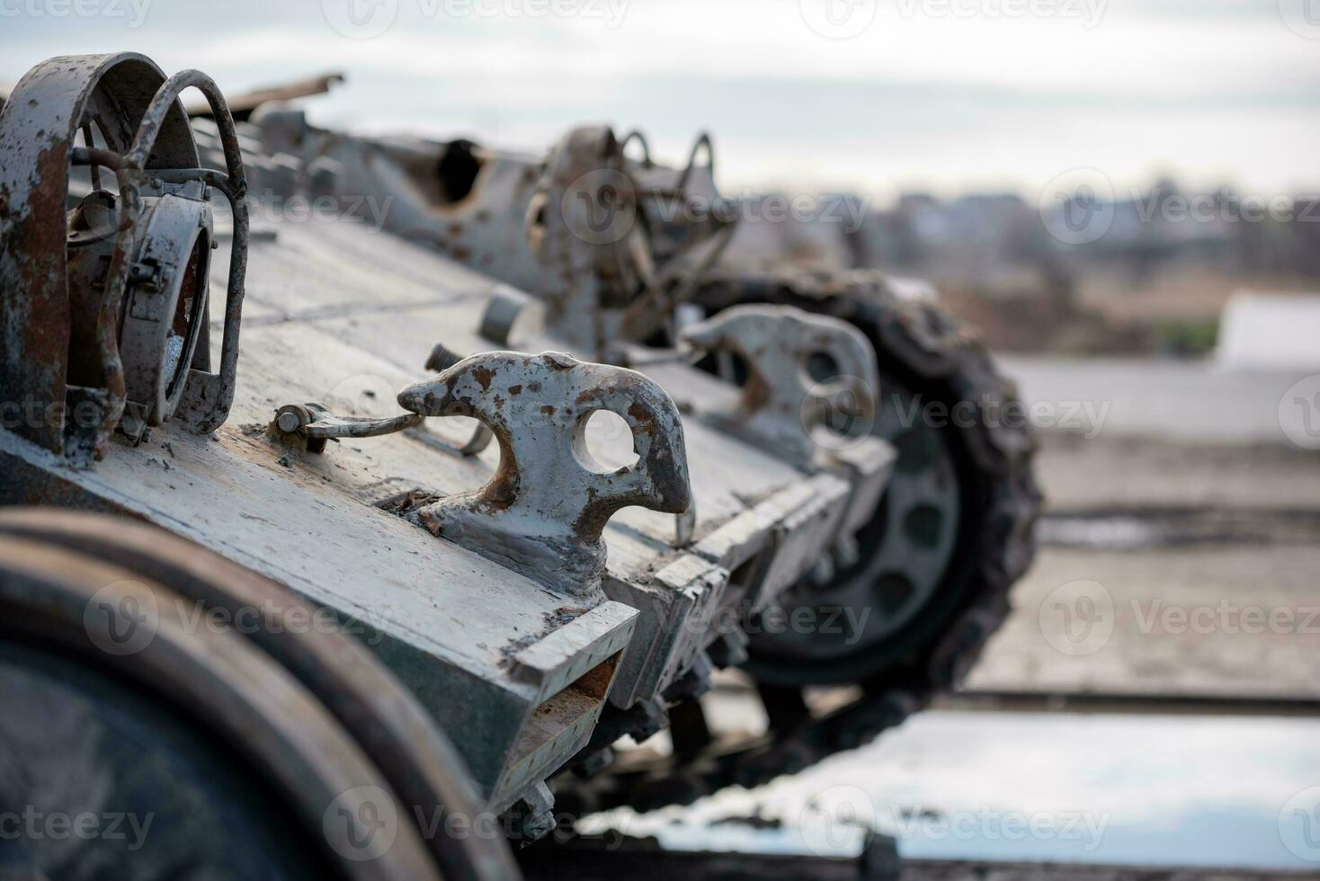 damaged military tank on a city street in Ukraine photo