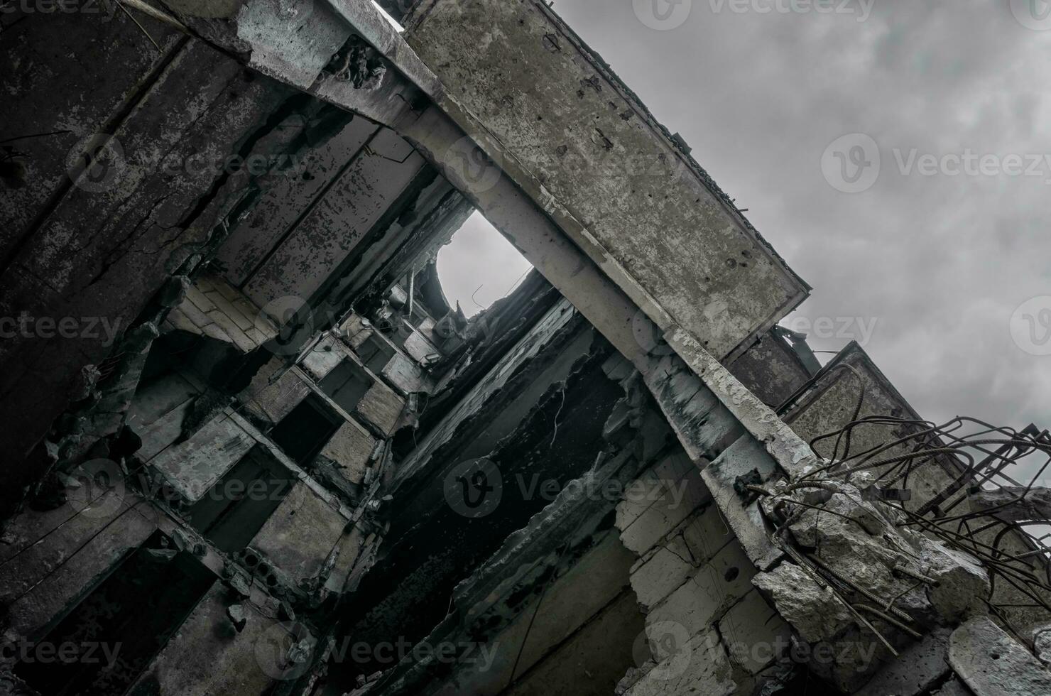 destroyed and burned houses in the city during the war in Ukraine photo