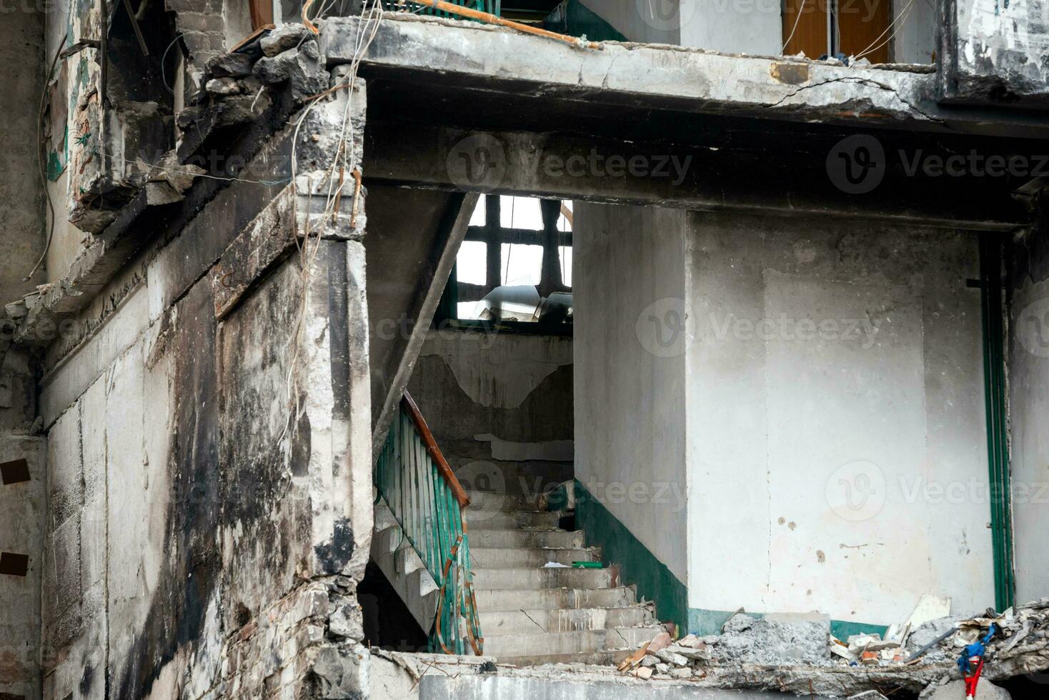 destroyed and burned houses in the city during the war in Ukraine photo