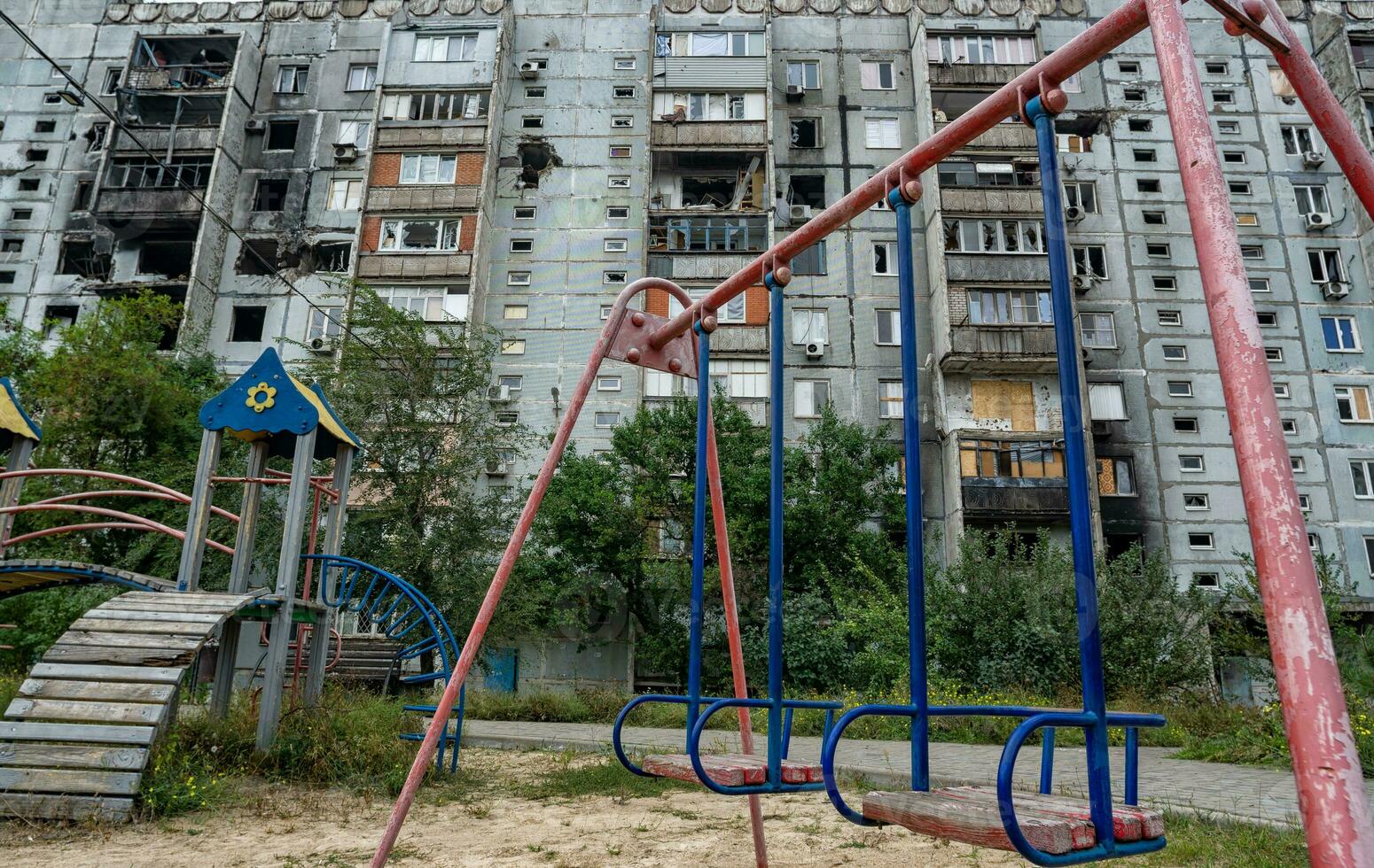 destroyed and burned houses in the city during the war in Ukraine photo