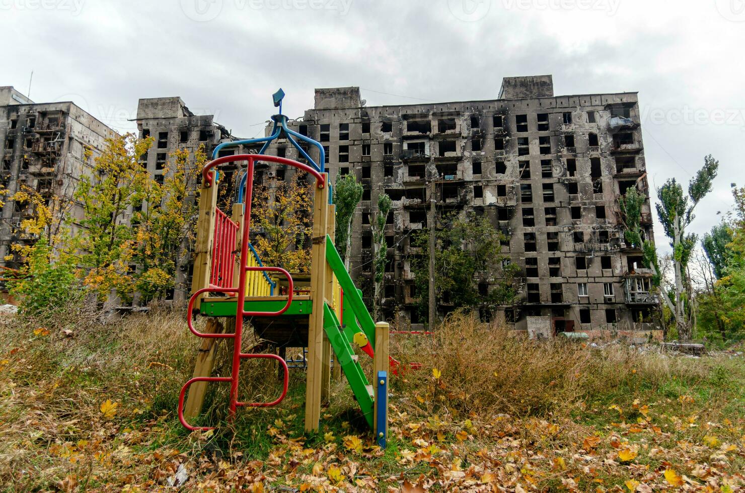 destroyed and burned houses in the city during the war in Ukraine photo