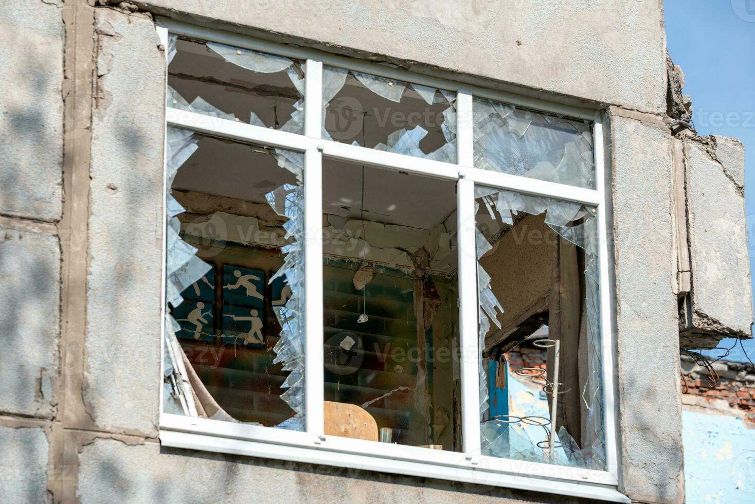 destroyed and burned school in the city Russia Ukraine war photo