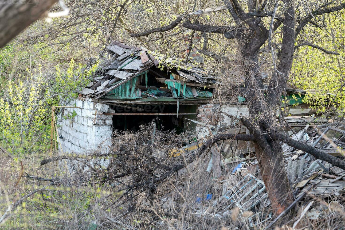 destroyed and burned houses in the city Russia Ukraine war photo