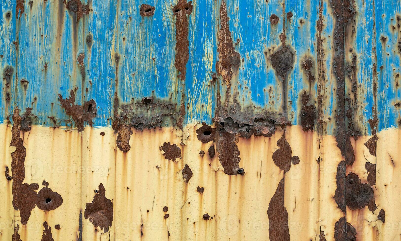 damaged blue yellow house wall war in Ukraine photo