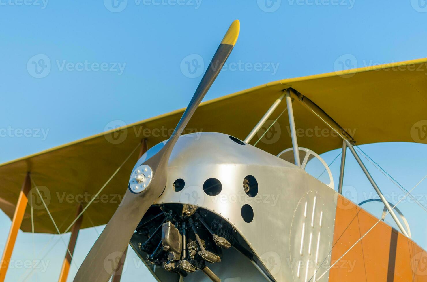 cockpit with propeller and wings of a vintage airplane photo