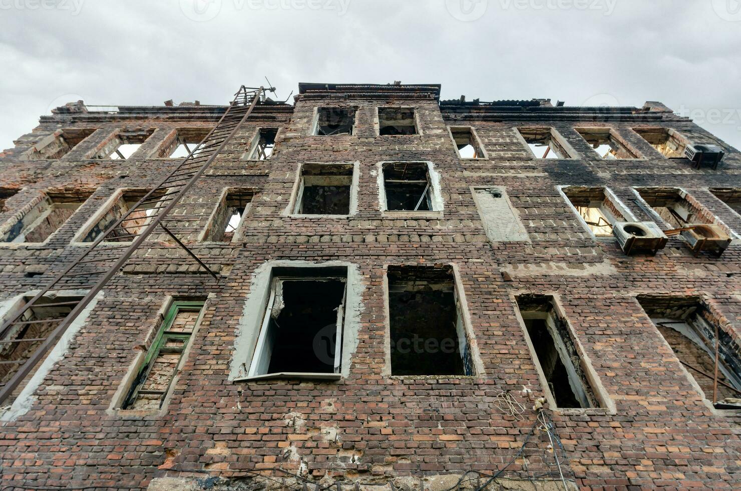 destroyed and burned houses in the city Russia Ukraine war photo