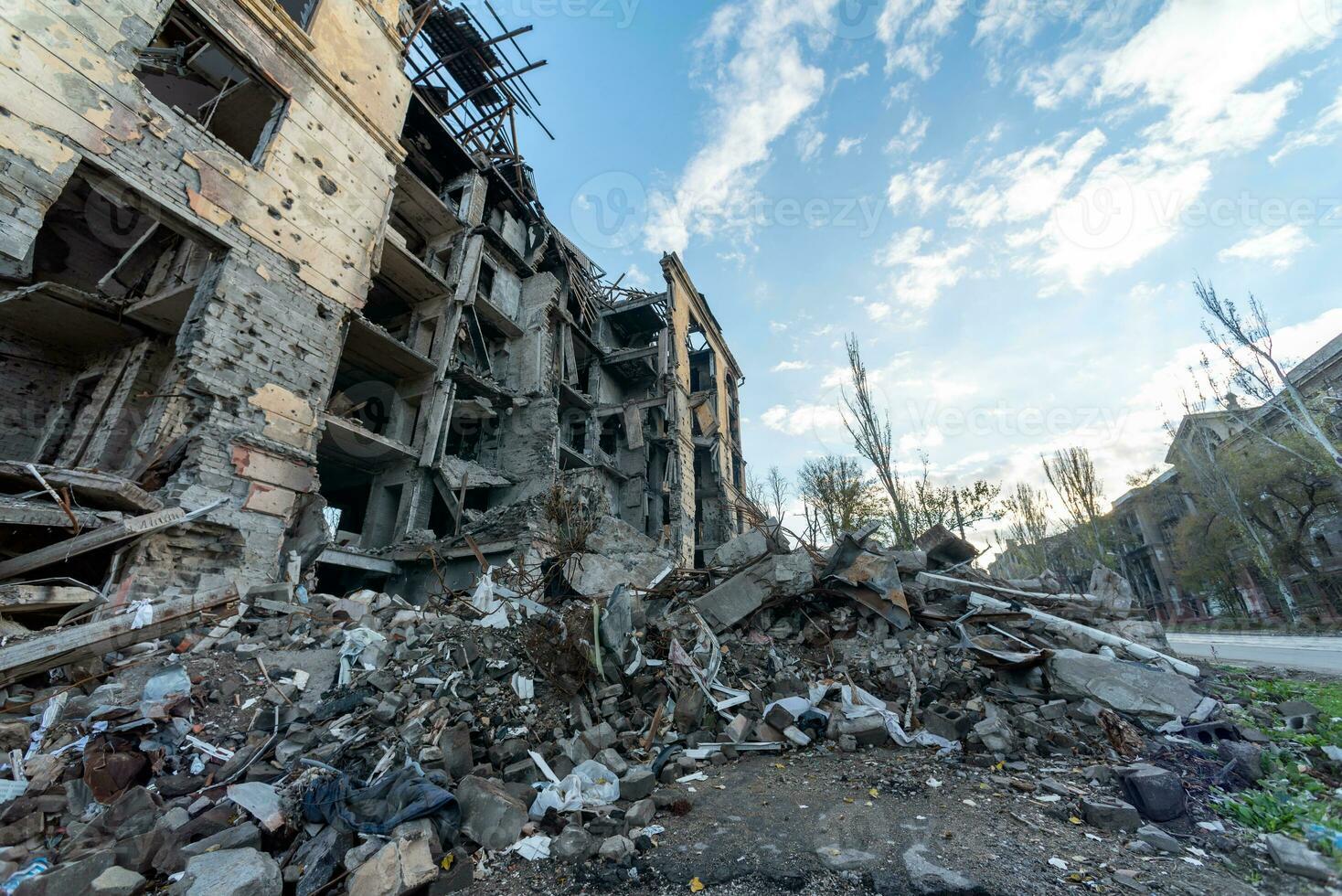 destroyed and burned houses in the city during the war in Ukraine photo