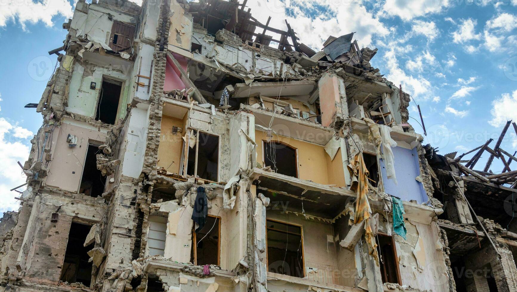 destroyed and burned houses in the city in Ukraine war photo